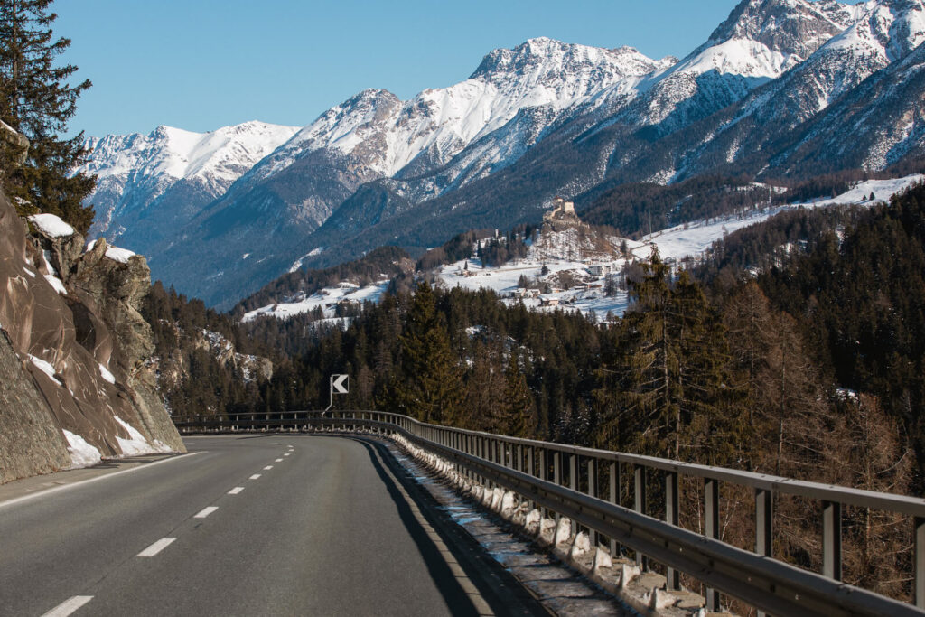 Road curving through the Swiss Alps towards Tarasp, Graubünden Switzerland taken by Switzerland writer and photographer